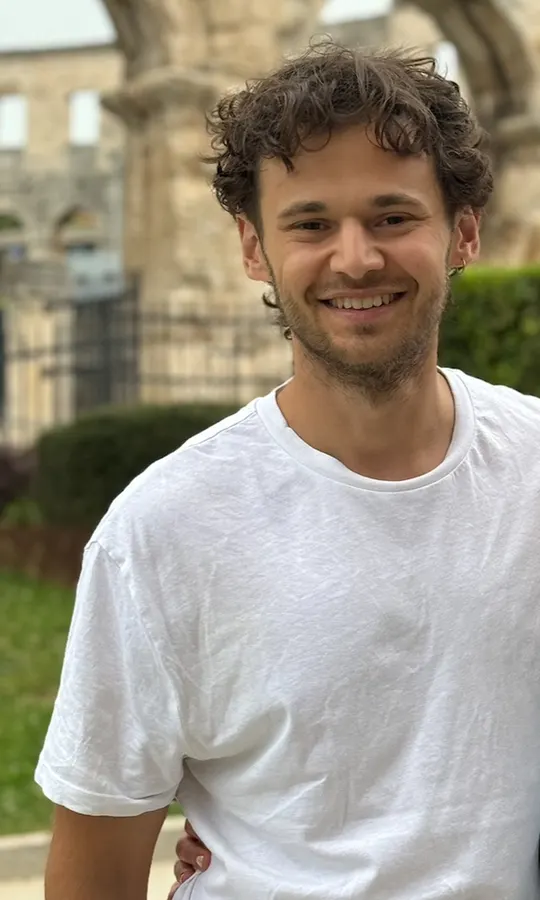 A shopper's own photo, wearing a plain white t-shirt
