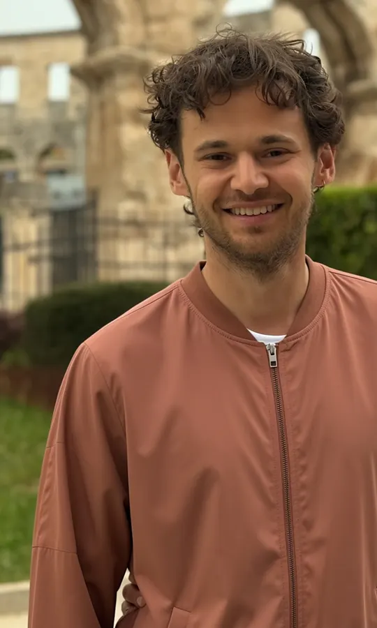 The same shopper wearing the bomber jacket